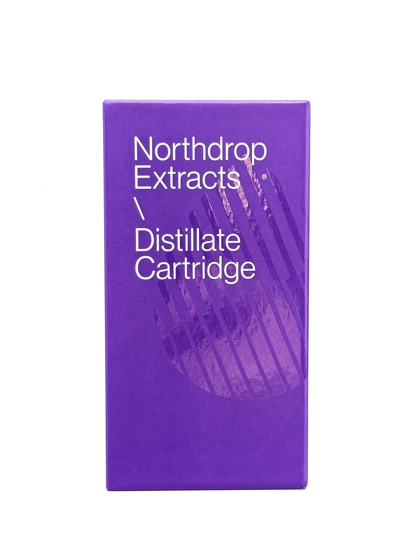 Front of the closed purple Northdrop Extracts Distillate Cartridge box, shot on white